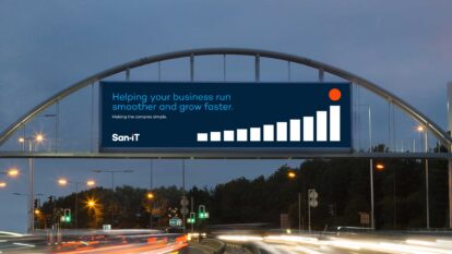 San-iT advertising billboard saying 'Helping your business run smoother and grow faster.'