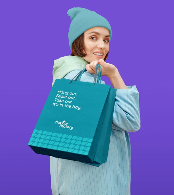 woman holding flavour factory bag