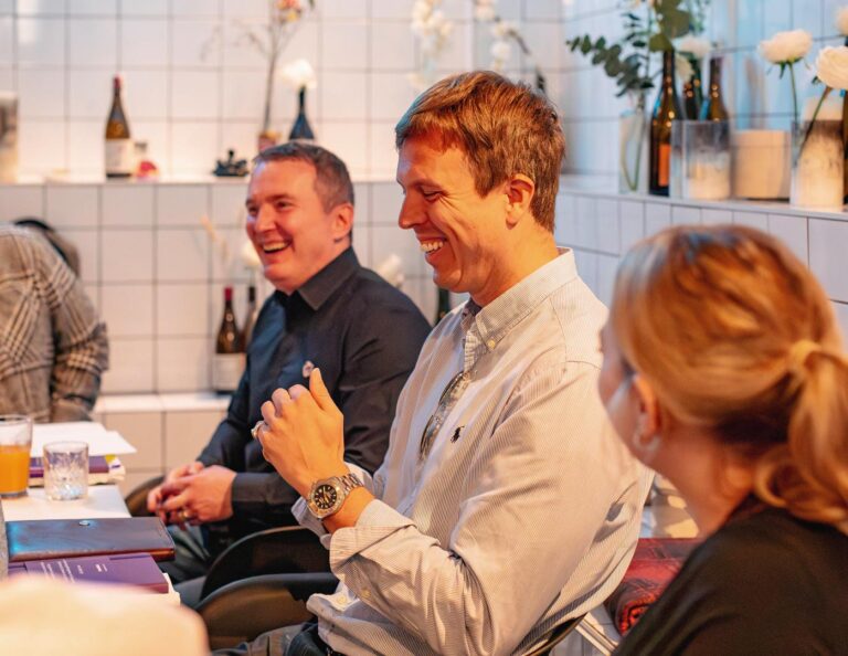 People laughing at breakthrough breakfast